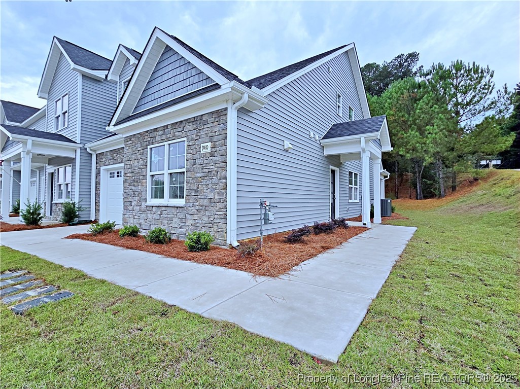 940 Kensington Park Road Fayetteville, NC 28311 - Photo 38 of 41 a front view of house with yard and trees in the background