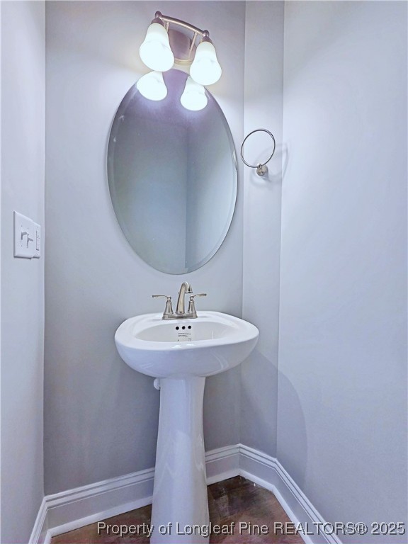 940 Kensington Park Road Fayetteville, NC 28311 - Photo 7 of 38 a bathroom with a sink and a mirror