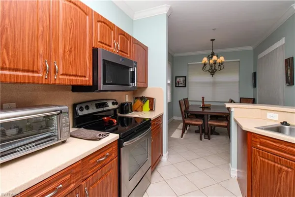 a kitchen with a stove and a microwave