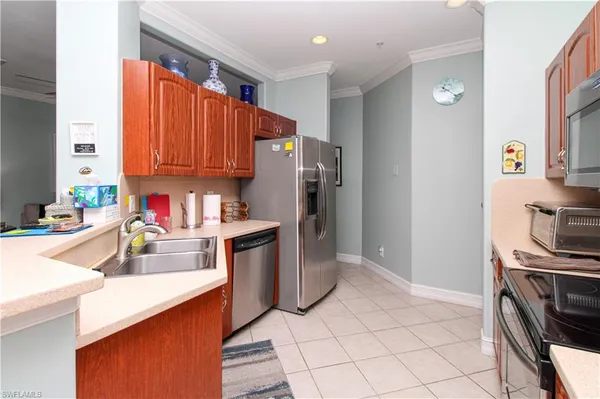 a kitchen with a refrigerator sink and stove