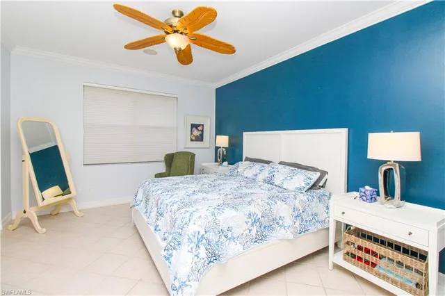 a bedroom with a bed a desk and chair