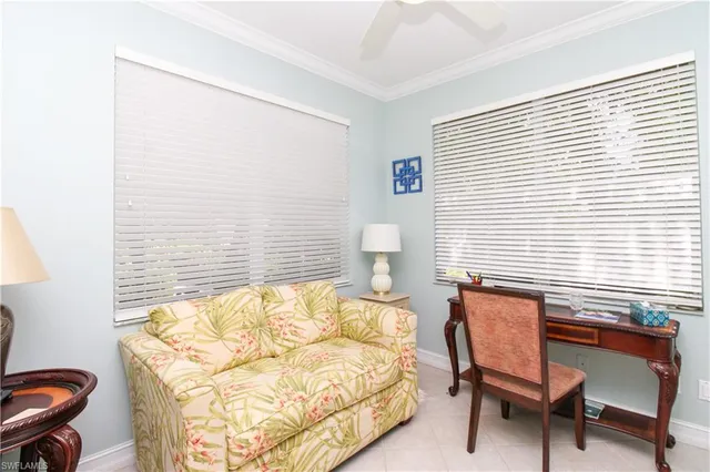 a bedroom with a bed and a chair