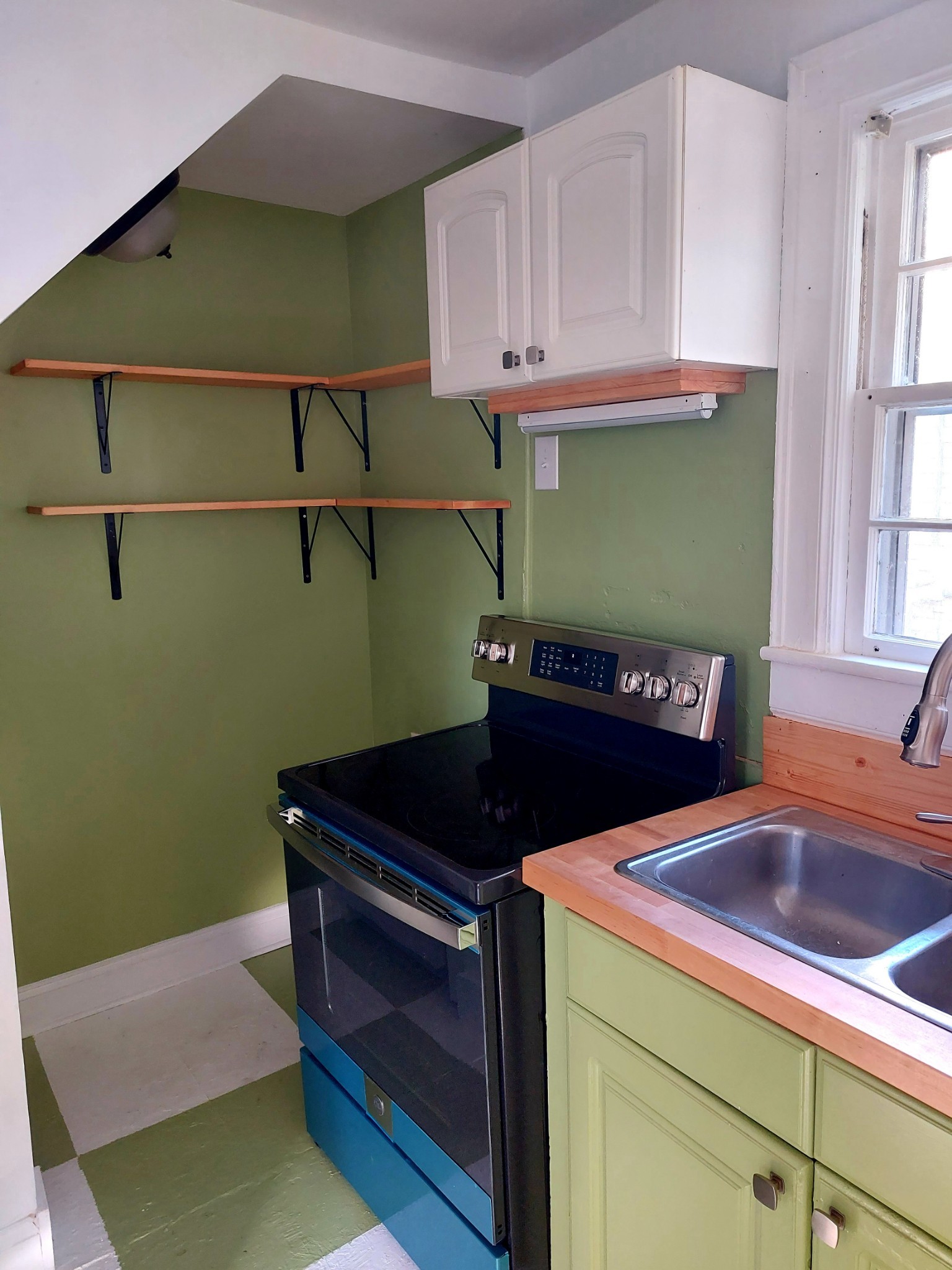 324 Harrington Avenue Madison, TN 37115 - Photo 4 of 12 a kitchen with a sink and cabinets