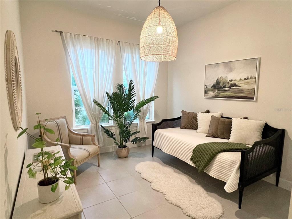 2337 Clemblue Road Clermont, FL 34715 - Photo 20 of 33 a living room with furniture and a chandelier