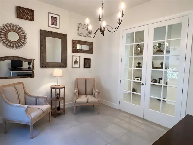 a living room with furniture a rug and a window