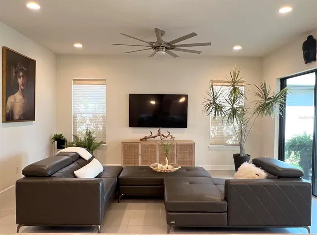 a living room with furniture and a flat screen tv