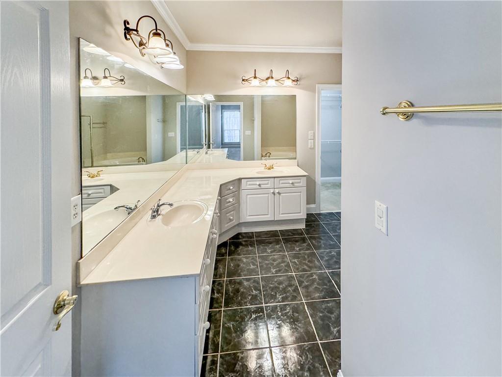 2000 Sterling Court Roswell, GA 30075 - Photo 21 of 45 a bathroom with a double vanity sink mirror and