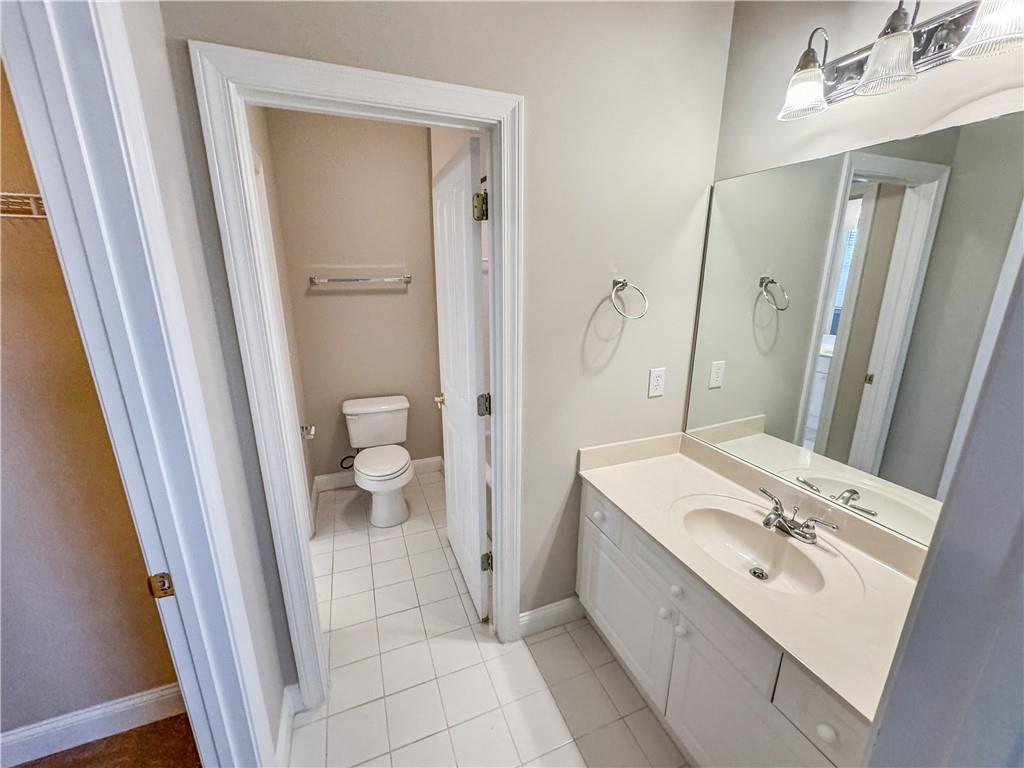 2000 Sterling Court Roswell, GA 30075 - Photo 34 of 45 a bathroom with a sink a toilet and a mirror