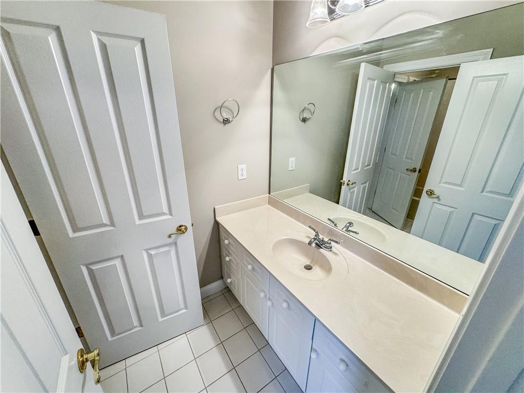2000 Sterling Court Roswell, GA 30075 - Photo 37 of 45 a spacious bathroom with a double vanity sink and a mirror