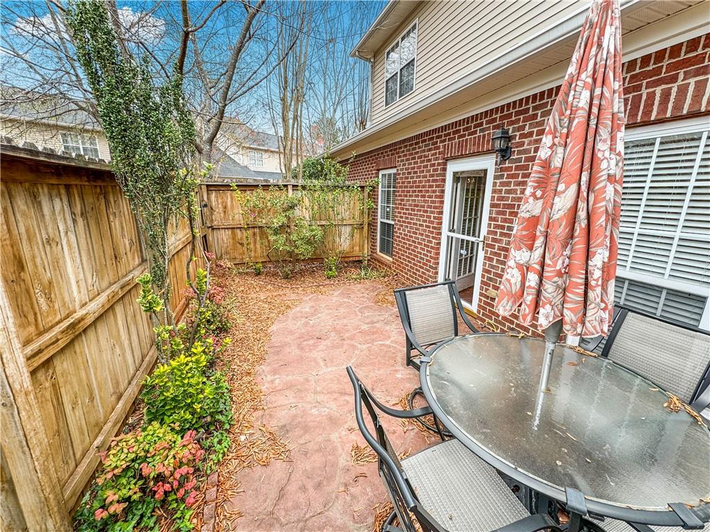 2000 Sterling Court Roswell, GA 30075 - Photo 44 of 45 a backyard of a house with outdoor seating