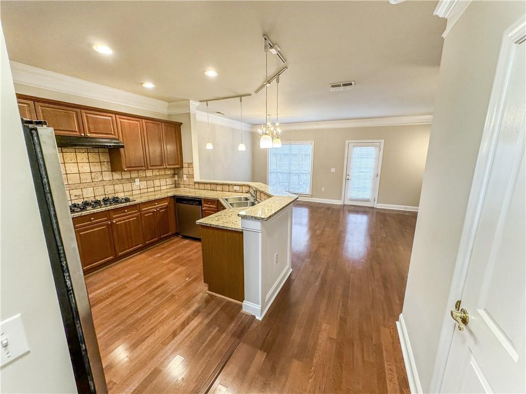 2000 Sterling Court Roswell, GA 30075 - Photo 10 of 45 a kitchen with stainless steel appliances granite countertop a sink stove and refrigerator