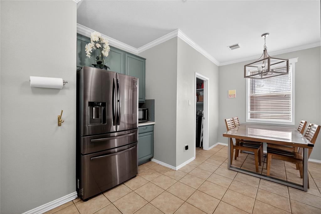 9633 Anns Way Plano, TX 75025 - Photo 15 of 37 a kitchen with stainless steel appliances a refrigerator and a stove top oven