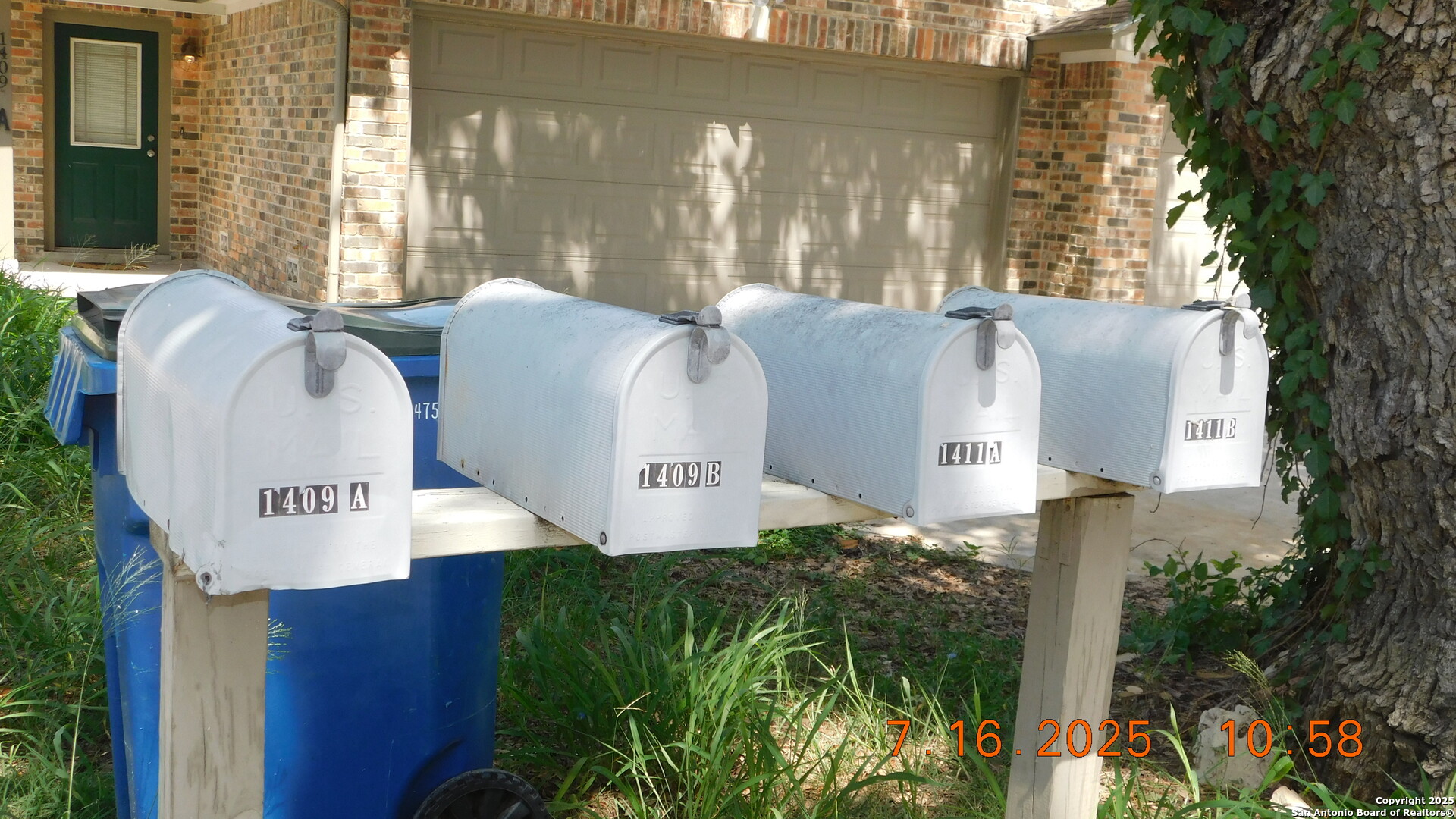 1409 West Martin Pleasanton, TX 78064 - Photo 5 of 6 a front view of a house with garden and plants