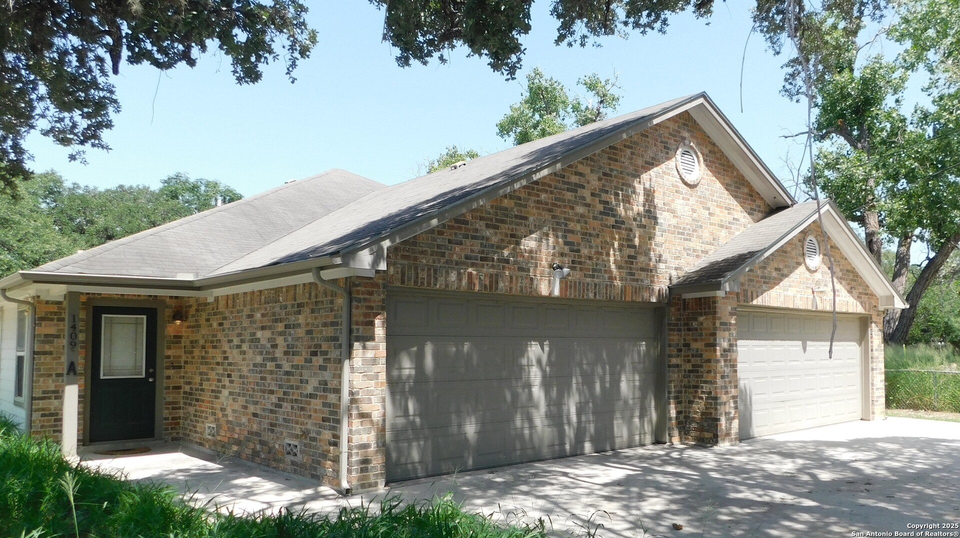 1409 West Martin Pleasanton, TX 78064 - Photo 6 of 6 a view of a house with a yard