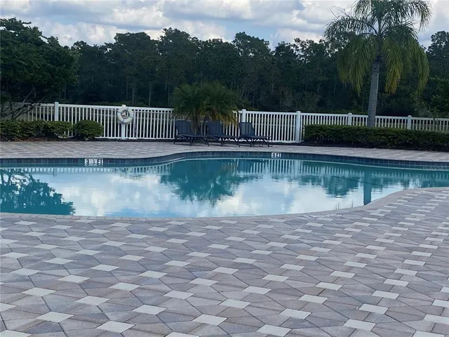 a view of a wooden fence next to a road