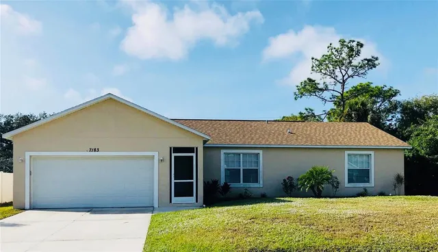 a view of house with yard and entertaining space