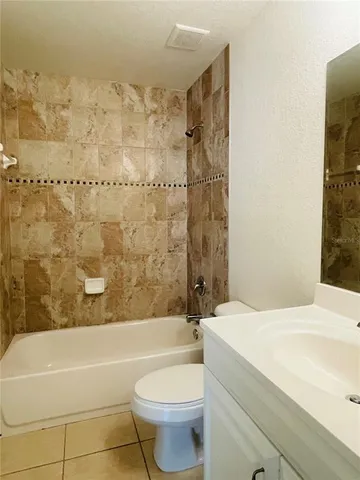 a bathroom with a bathtub toilet and sink