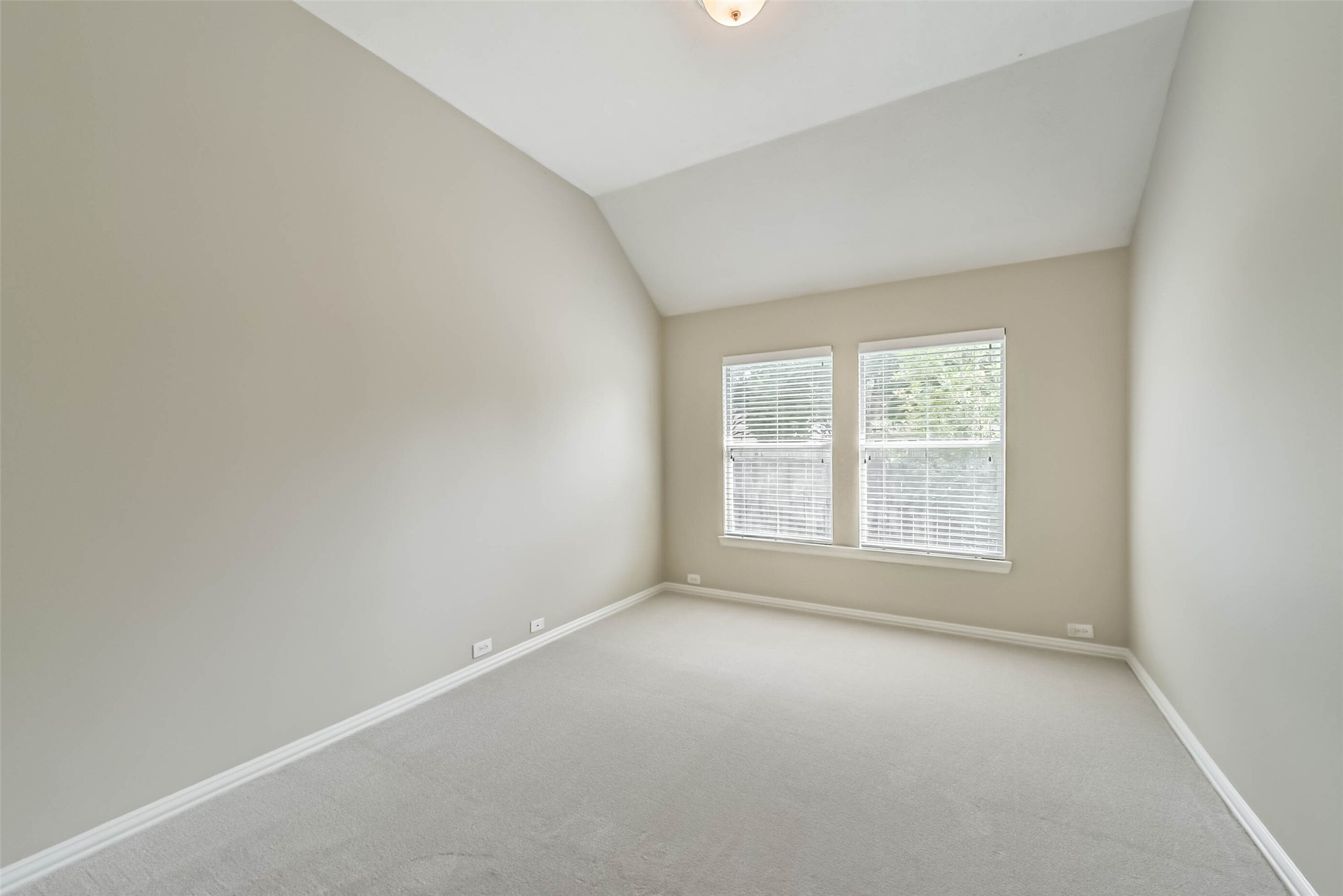 30910 Blue Ridge Park Lane Spring, TX 77386 - Photo 33 of 50 Bright and spacious room with neutral walls and plush carpeting, featuring large windows that let in ample natural light.