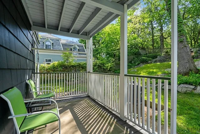 a view of a balcony with wooden floor