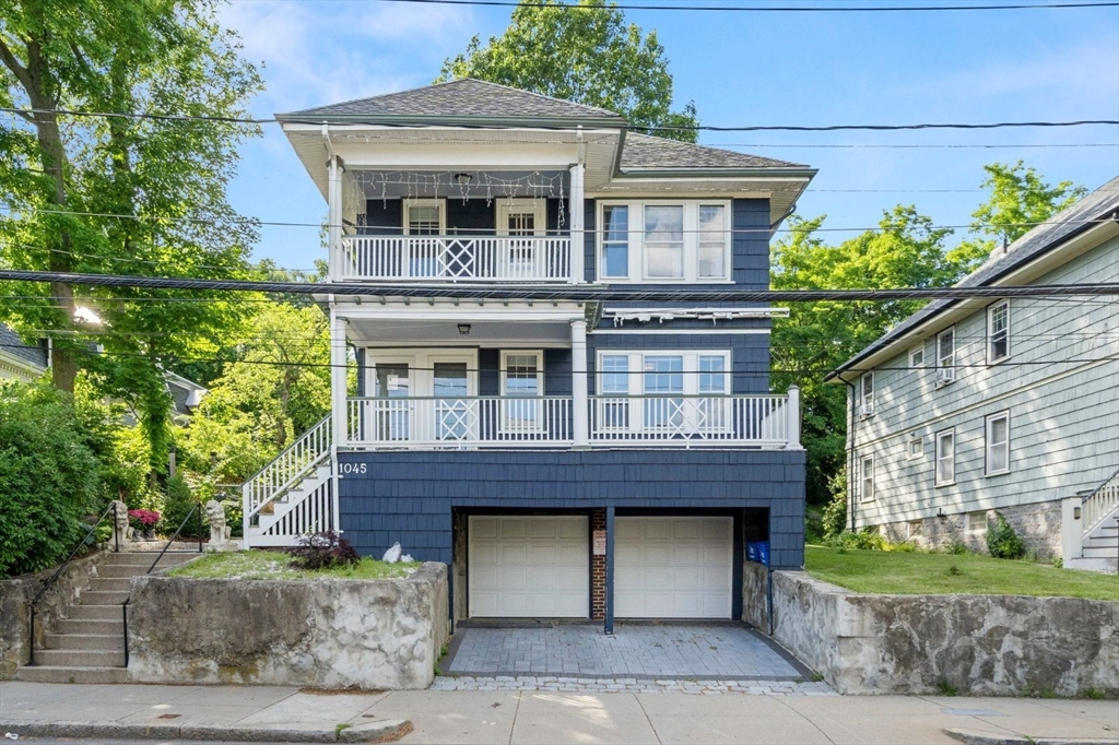 1045 Adams Street, Unit 1 Boston, MA 02124 - Photo 25 of 30 a front view of a house with a garden