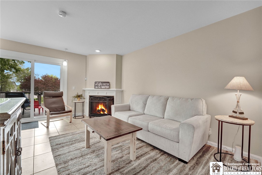4406 West Lake Road, Unit 24 Chautauqua, NY 14757 - Photo 13 of 42 Light and bright livingroom area / dining area.