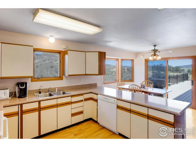 a kitchen with stainless steel appliances a refrigerator and a sink