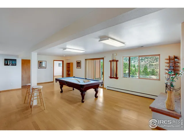 a living room with furniture and a kitchen view