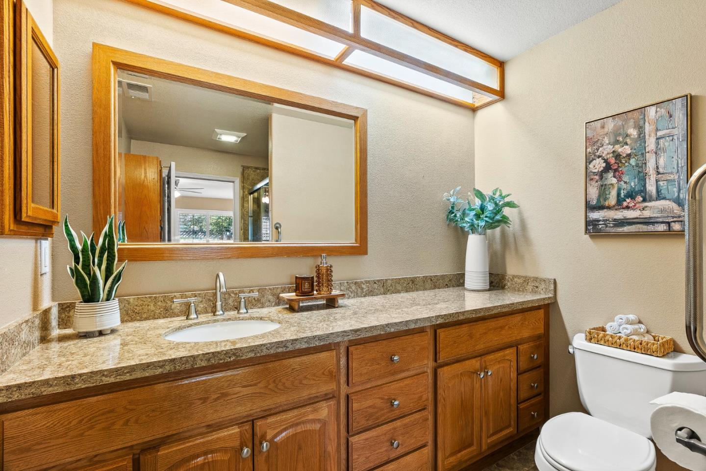 16950 Sugar Pine Drive Morgan Hill, CA 95037 - Photo 25 of 48 a bathroom with a granite countertop sink mirror and toilet