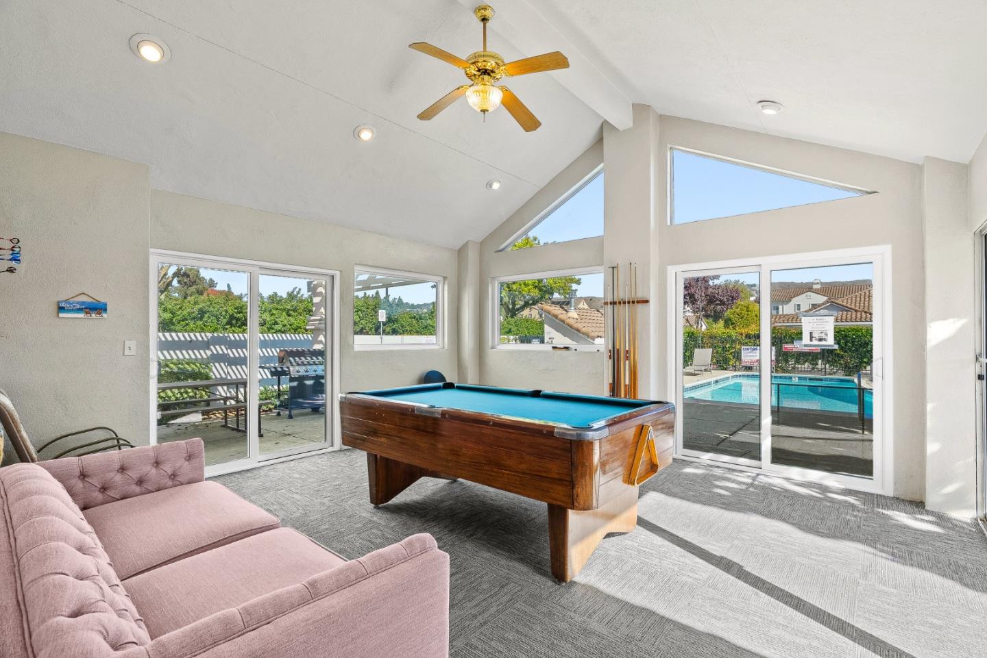 16950 Sugar Pine Drive Morgan Hill, CA 95037 - Photo 32 of 48 a living room with furniture a large window and a chandelier