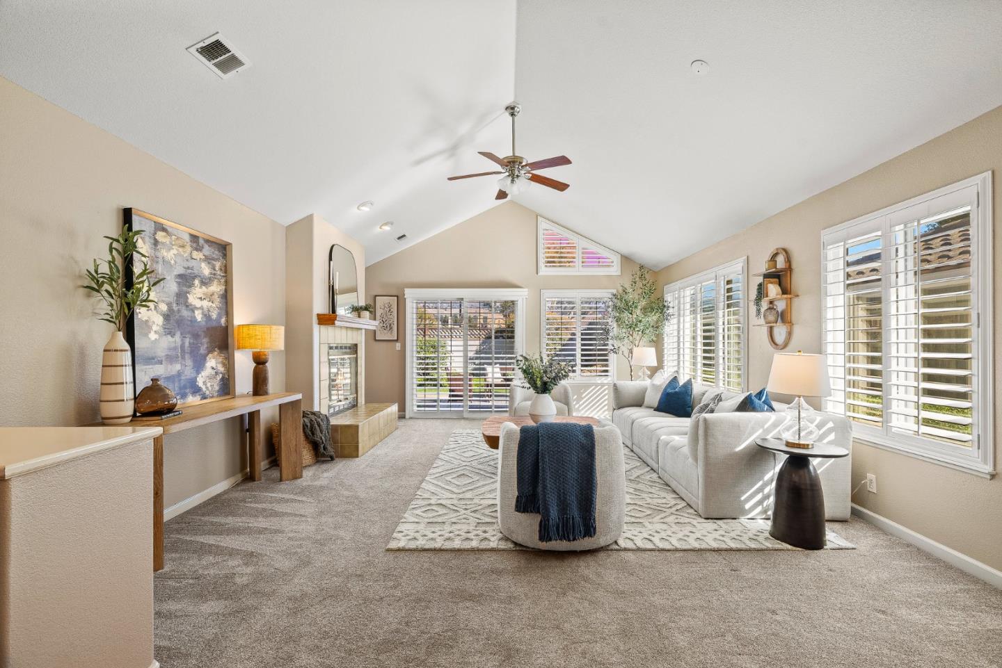 16950 Sugar Pine Drive Morgan Hill, CA 95037 - Photo 6 of 48 a large living room with furniture a large window and chandelier