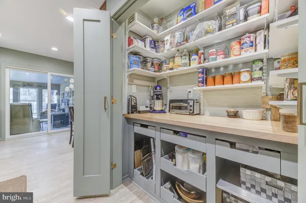 a kitchen with stainless steel appliances granite countertop a lot of counter top space and cabinets