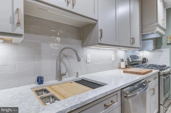 a kitchen with a sink and cabinets