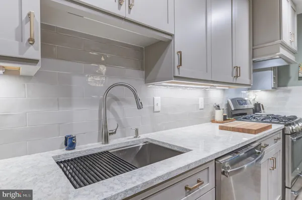 a kitchen with a sink and cabinets