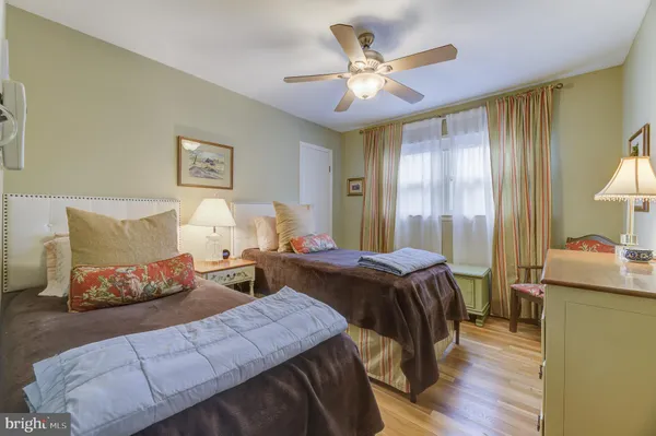 a bed room with a bed and a chandelier