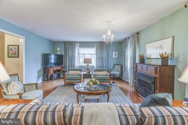 a living room with furniture and a breakfast area