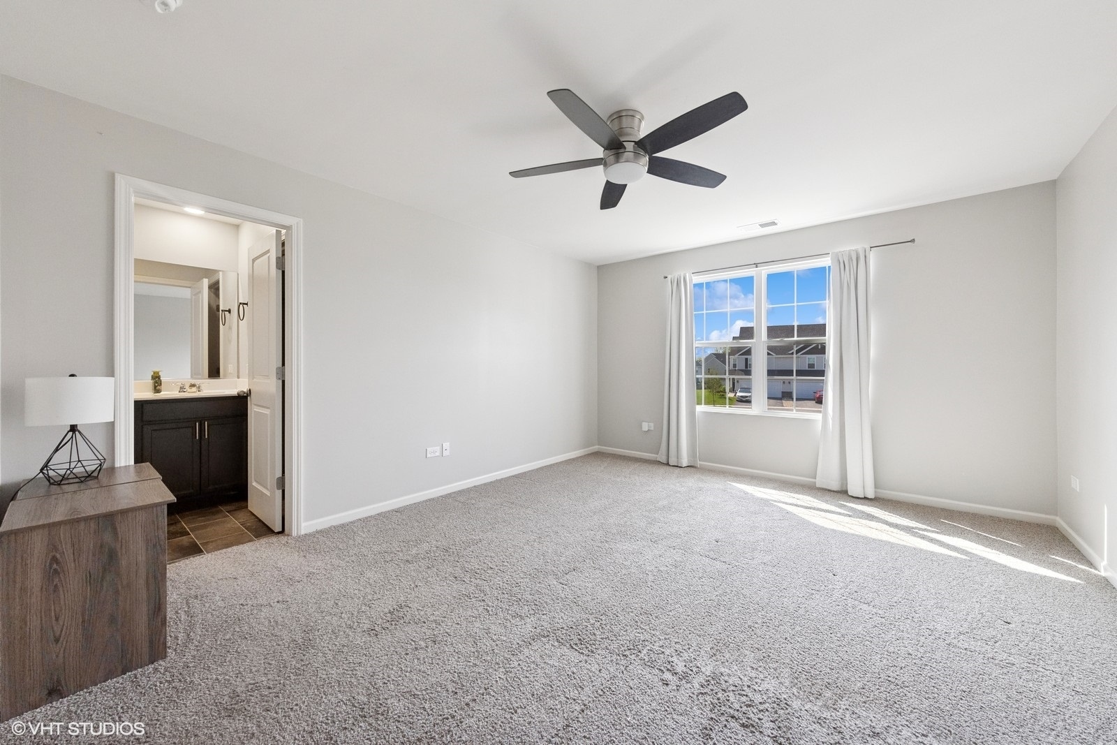1234 Violet Ct. Joliet, IL 60431 - Photo 12 of 23 a view of a livingroom with a ceiling fan and window