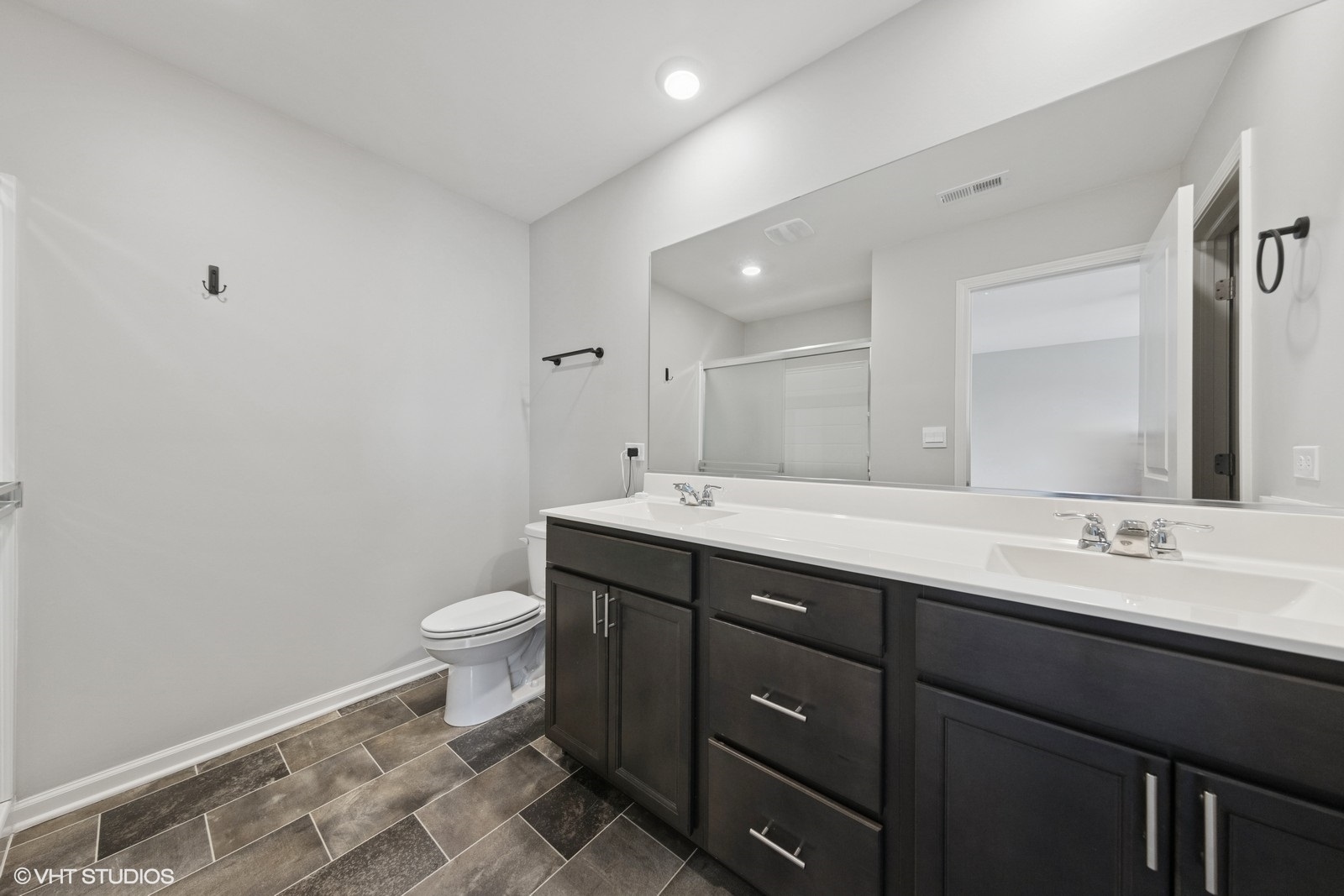 1234 Violet Ct. Joliet, IL 60431 - Photo 13 of 23 a bathroom with a double vanity sink and a mirror