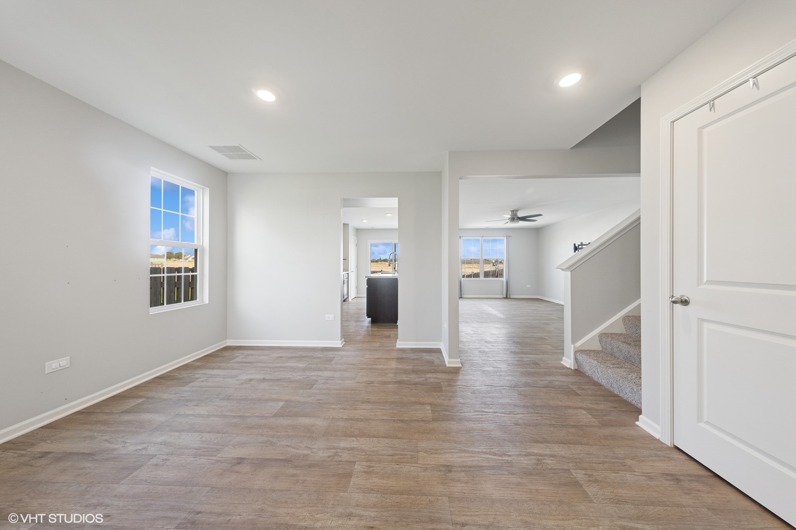 1234 Violet Ct. Joliet, IL 60431 - Photo 2 of 23 a view of an empty room with wooden floor and a window