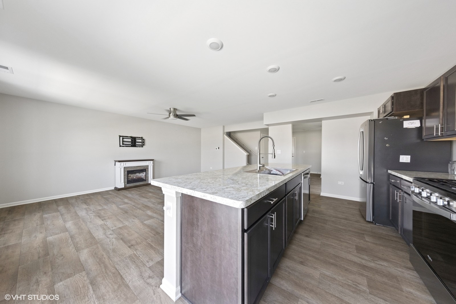 1234 Violet Ct. Joliet, IL 60431 - Photo 8 of 23 a kitchen with granite countertop a sink and a stove top oven