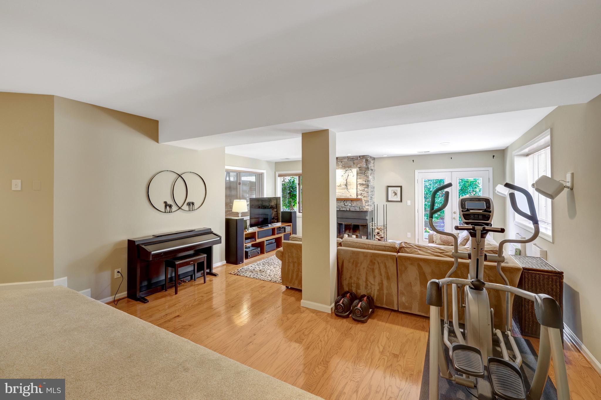 11122 Lakespray Way Reston, VA 20191 - Photo 53 of 77 Recreation room with hardwoods & walls of windows.