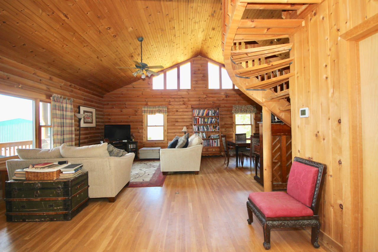 4860 Indian Valley Road Riner, VA 24149 - Photo 68 of 96 a living room with furniture a fireplace and a large window