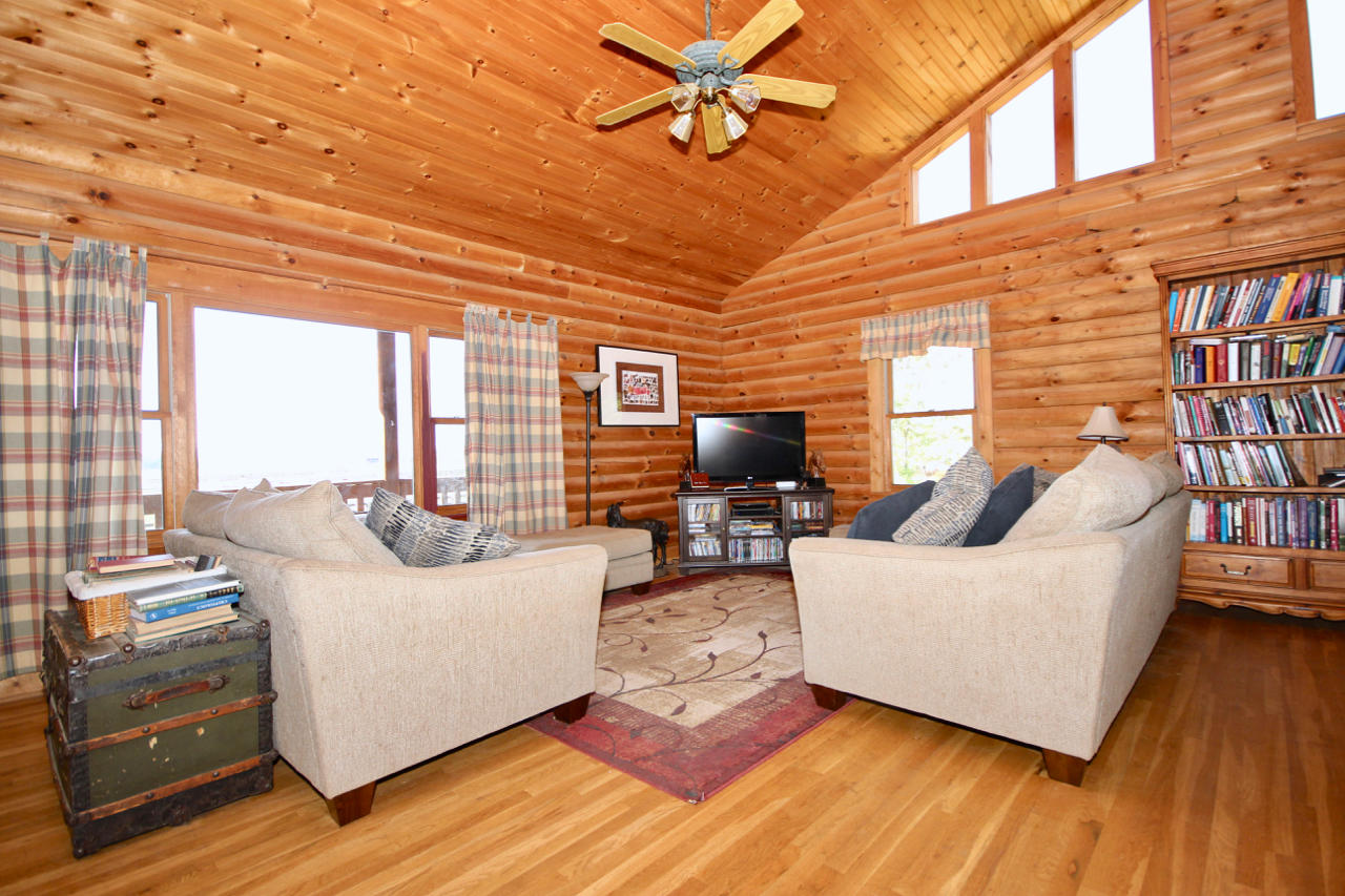 4860 Indian Valley Road Riner, VA 24149 - Photo 69 of 96 a living room with furniture and a flat screen tv