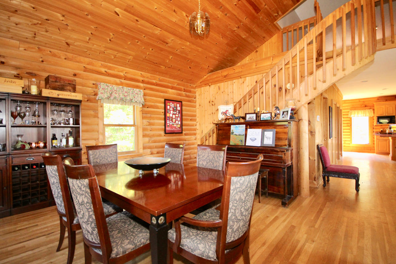4860 Indian Valley Road Riner, VA 24149 - Photo 71 of 96 a view of a dining room with furniture and wooden floor
