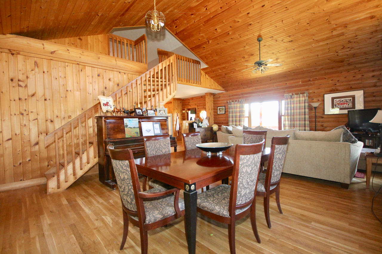 4860 Indian Valley Road Riner, VA 24149 - Photo 72 of 96 a view of a dining room with furniture and wooden floor