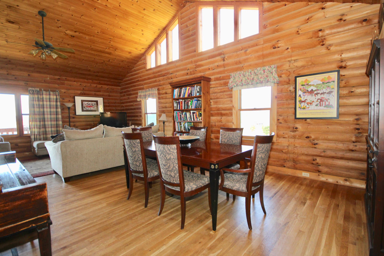 4860 Indian Valley Road Riner, VA 24149 - Photo 73 of 96 a view of a dining room with furniture and wooden floor