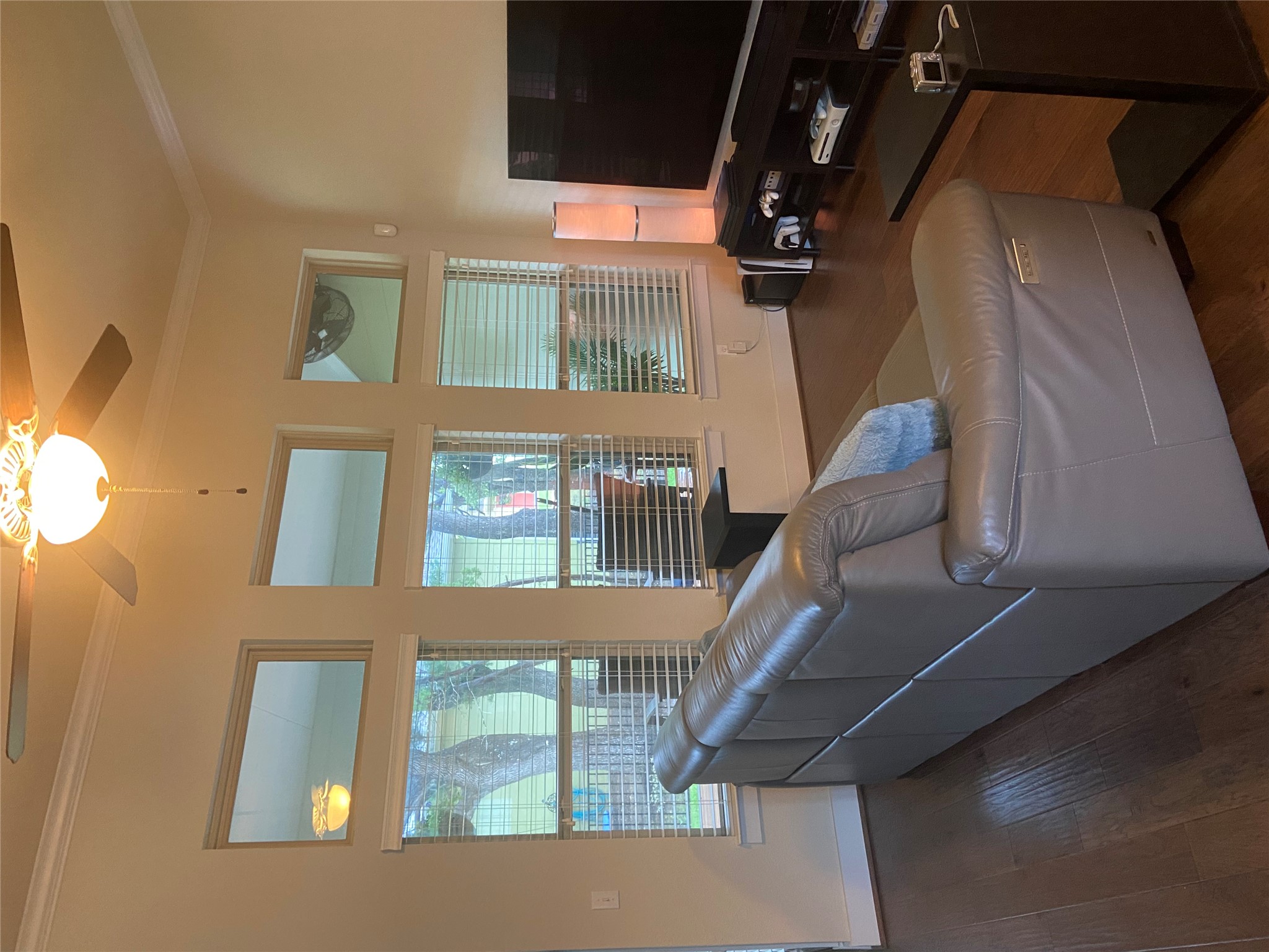 10629 Wills Loop, Unit 47 Austin, TX 78717 - Photo 6 of 17 Gleaming hardwood floors and a soaring ceiling with clerestory windows anchor the living area.