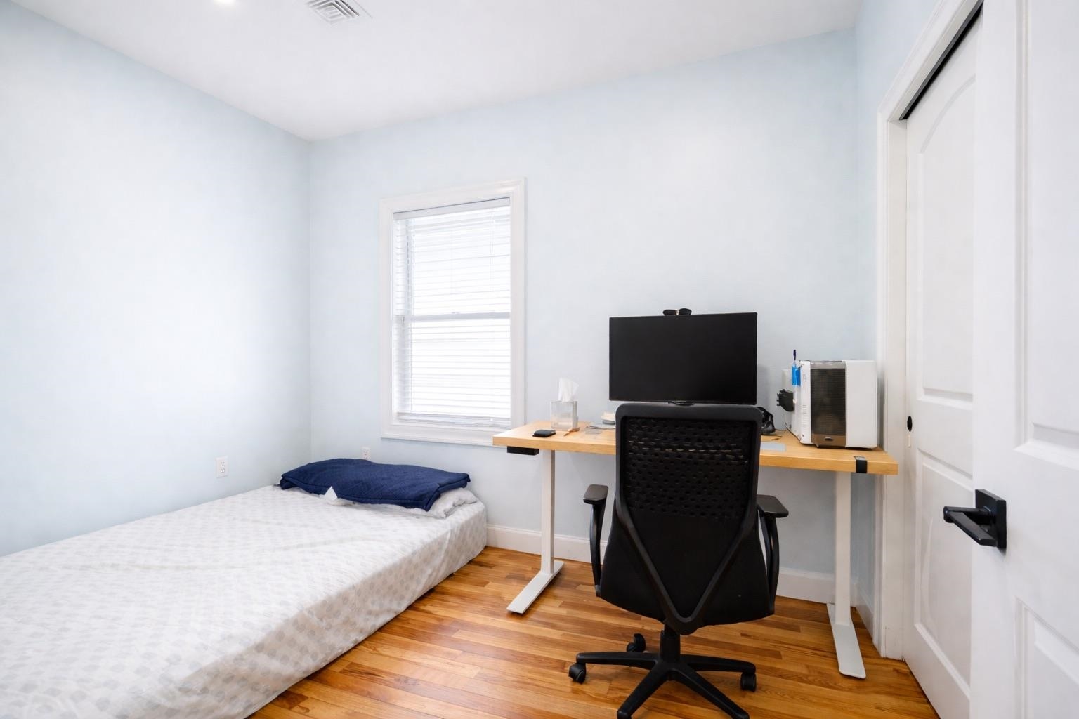 11 South 7th Street Harrison, NJ 07029 - Photo 17 of 29 a bedroom with a bed and furniture