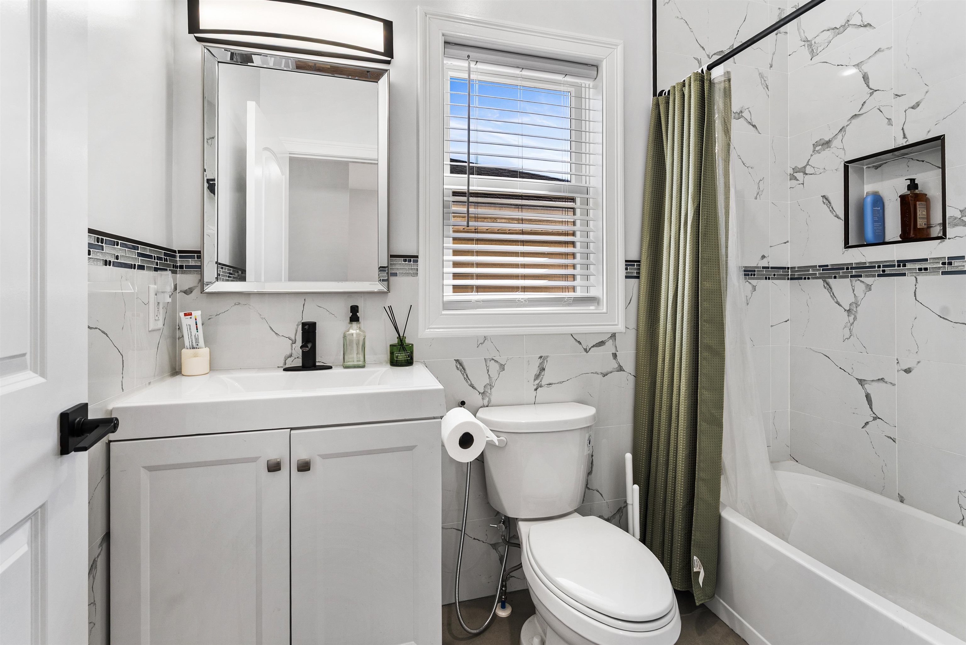 11 South 7th Street Harrison, NJ 07029 - Photo 18 of 29 a bathroom with a sink a toilet and shower