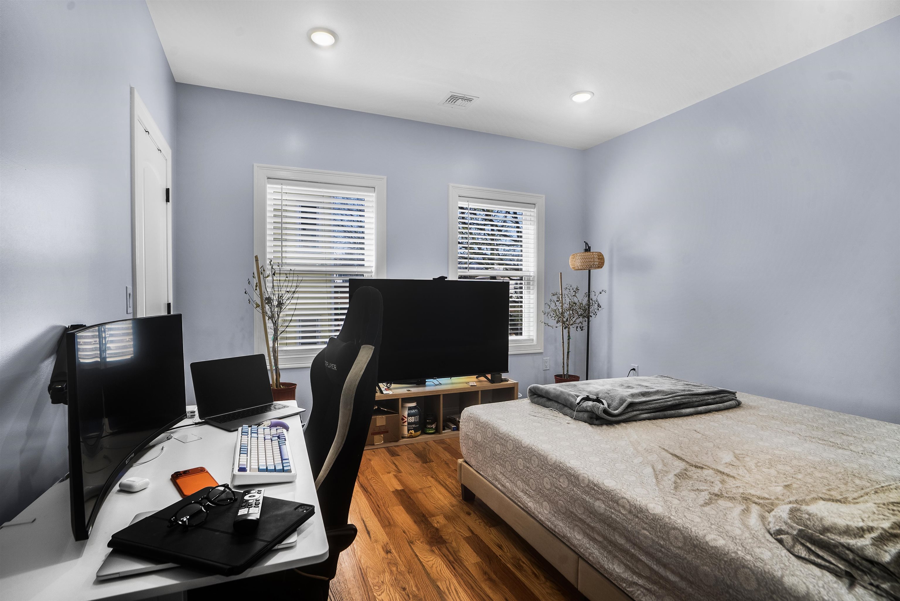 11 South 7th Street Harrison, NJ 07029 - Photo 19 of 29 a bedroom with a bed and a computer on a table