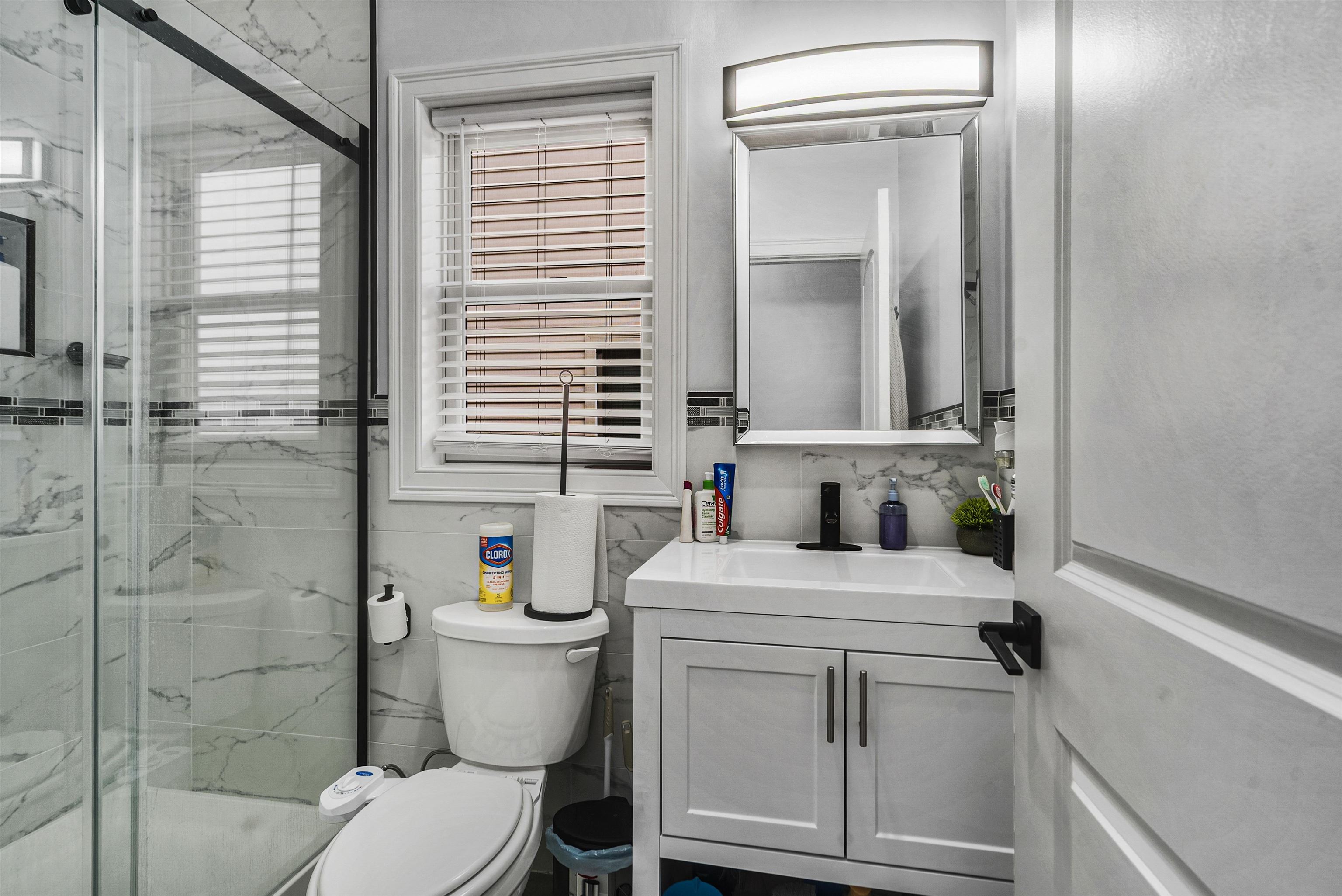 11 South 7th Street Harrison, NJ 07029 - Photo 20 of 29 a bathroom with a sink a toilet and shower